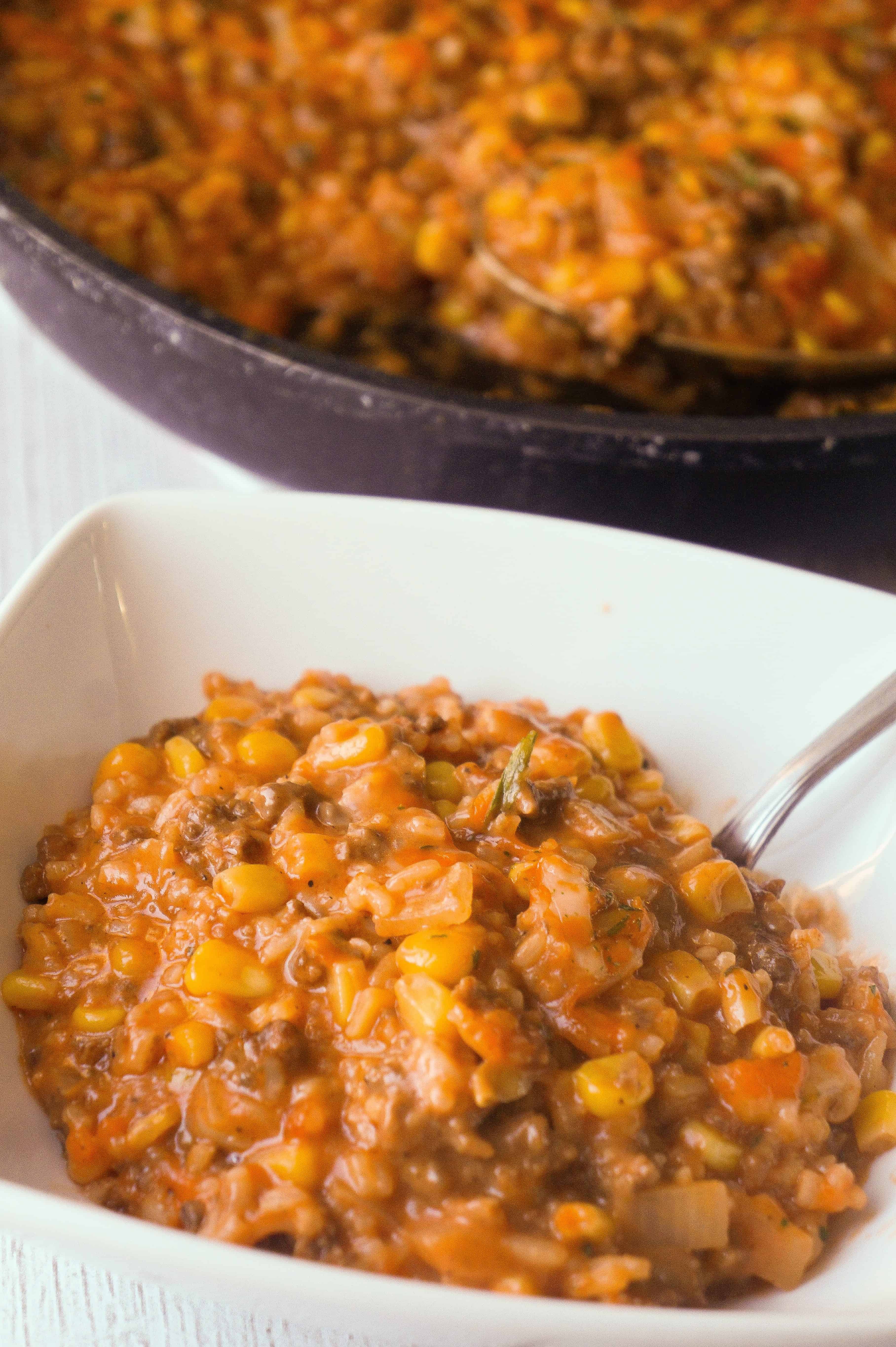 Cheesy Tomato Ground Beef and Rice is an easy stove top dinner recipe packed with flavour. This ground beef dish is made with cream of tomato soup, canned corn, instant rice and loaded with cheddar cheese.