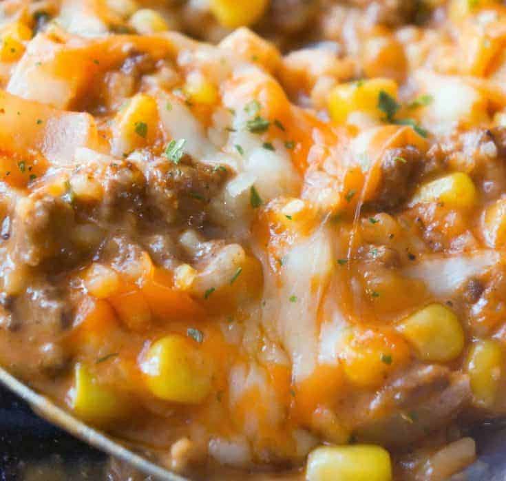 Cheesy Tomato Ground Beef and Rice is an easy stove top dinner recipe packed with flavour. This ground beef dish is made with cream of tomato soup, canned corn, instant rice and loaded with cheddar cheese.