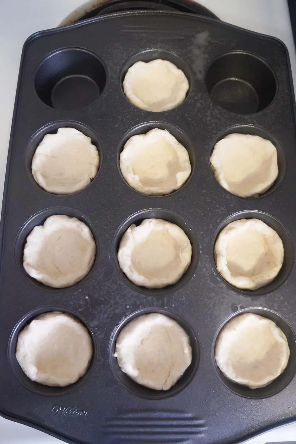 Pillsbury biscuit dough in muffin tins