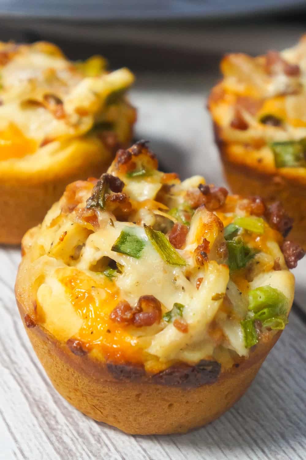 Chicken Bacon Ranch Biscuit Cups are a fun and easy party food. These biscuits loaded with rotisserie chicken, cheddar cheese and bacon are a delicious hand held snack.