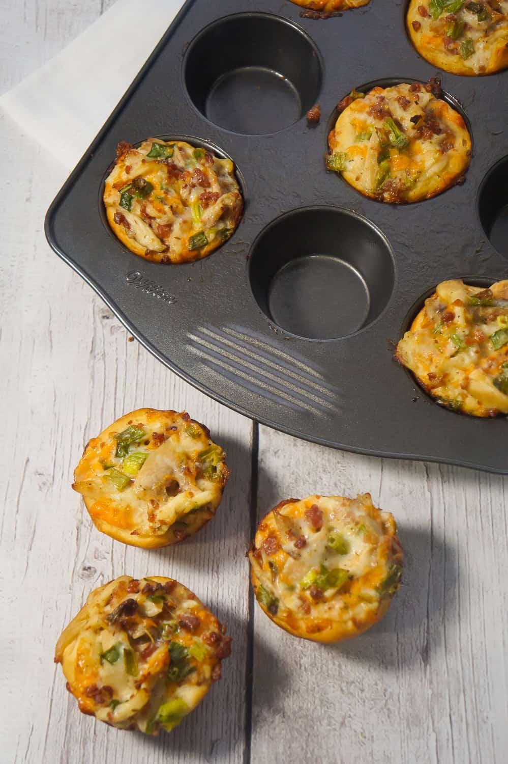 Chicken Bacon Ranch Biscuit Cups are a fun and easy party food. These biscuits loaded with rotisserie chicken, cheddar cheese and bacon are a delicious hand held snack.