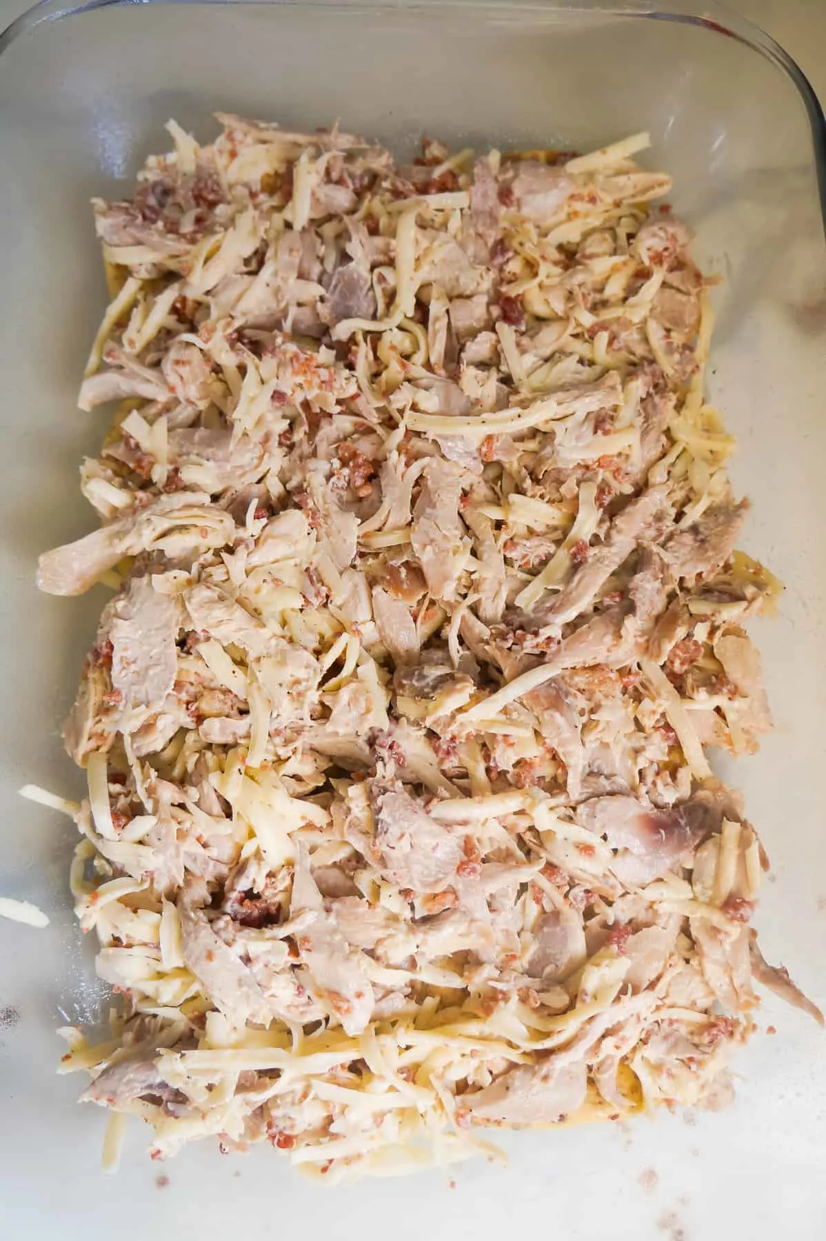 shredded chicken on cinnamon rolls
