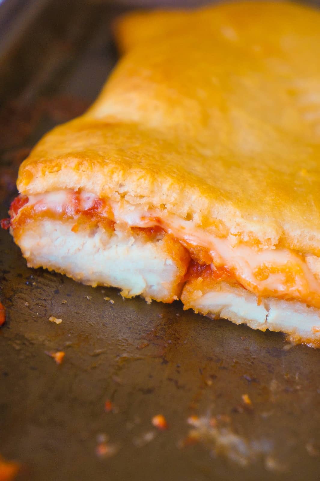 Chicken Parm Crescent Bake is an easy 5 ingredient dinner recipe. Breaded chicken with marinara sauce and mozzarella cheese topped with Pillsbury crescent roll dough is a delicious dinner your whole family will love.