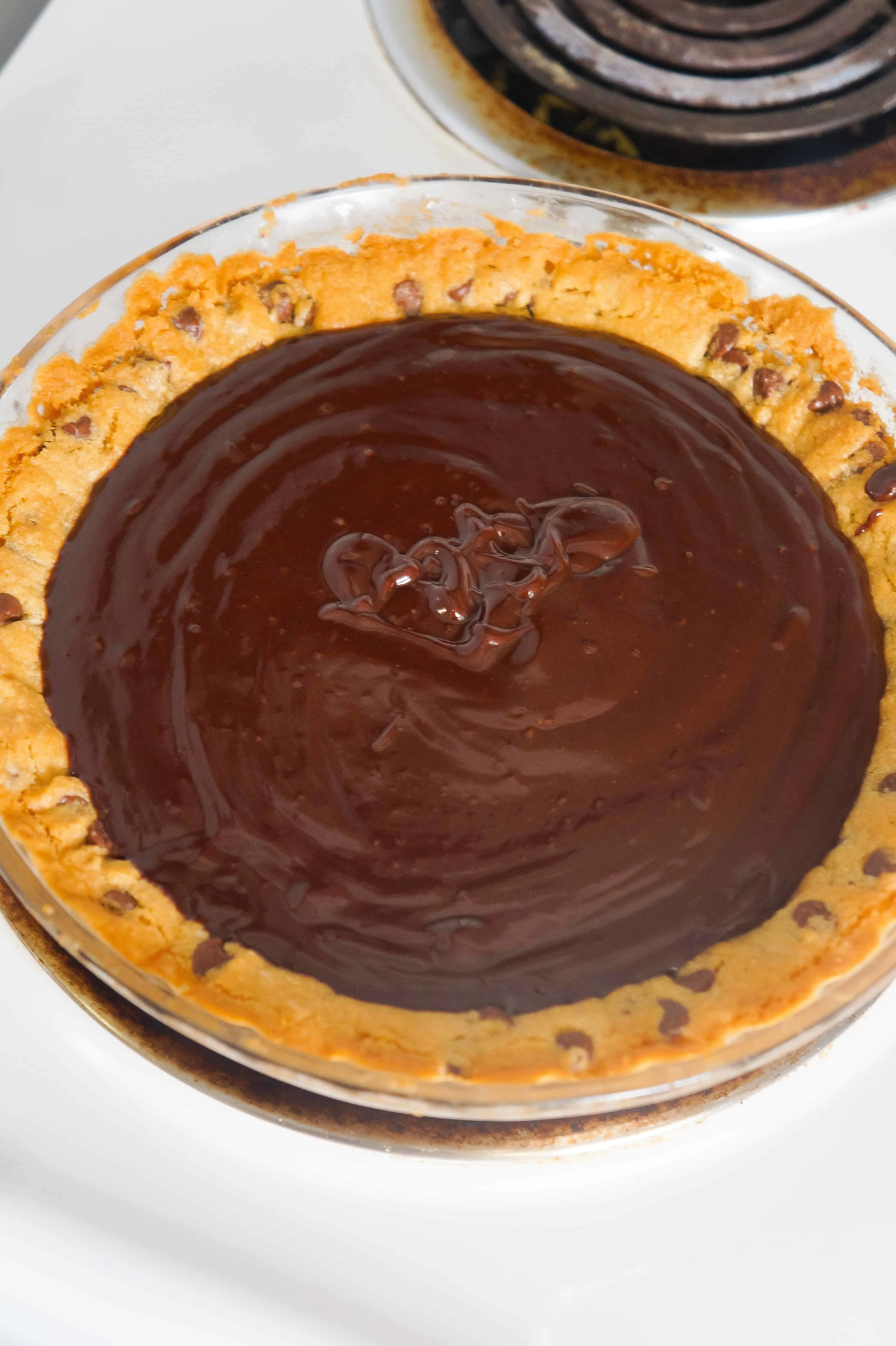 Creamy chocolate ganache in a chocolate chip cookie pie crust.