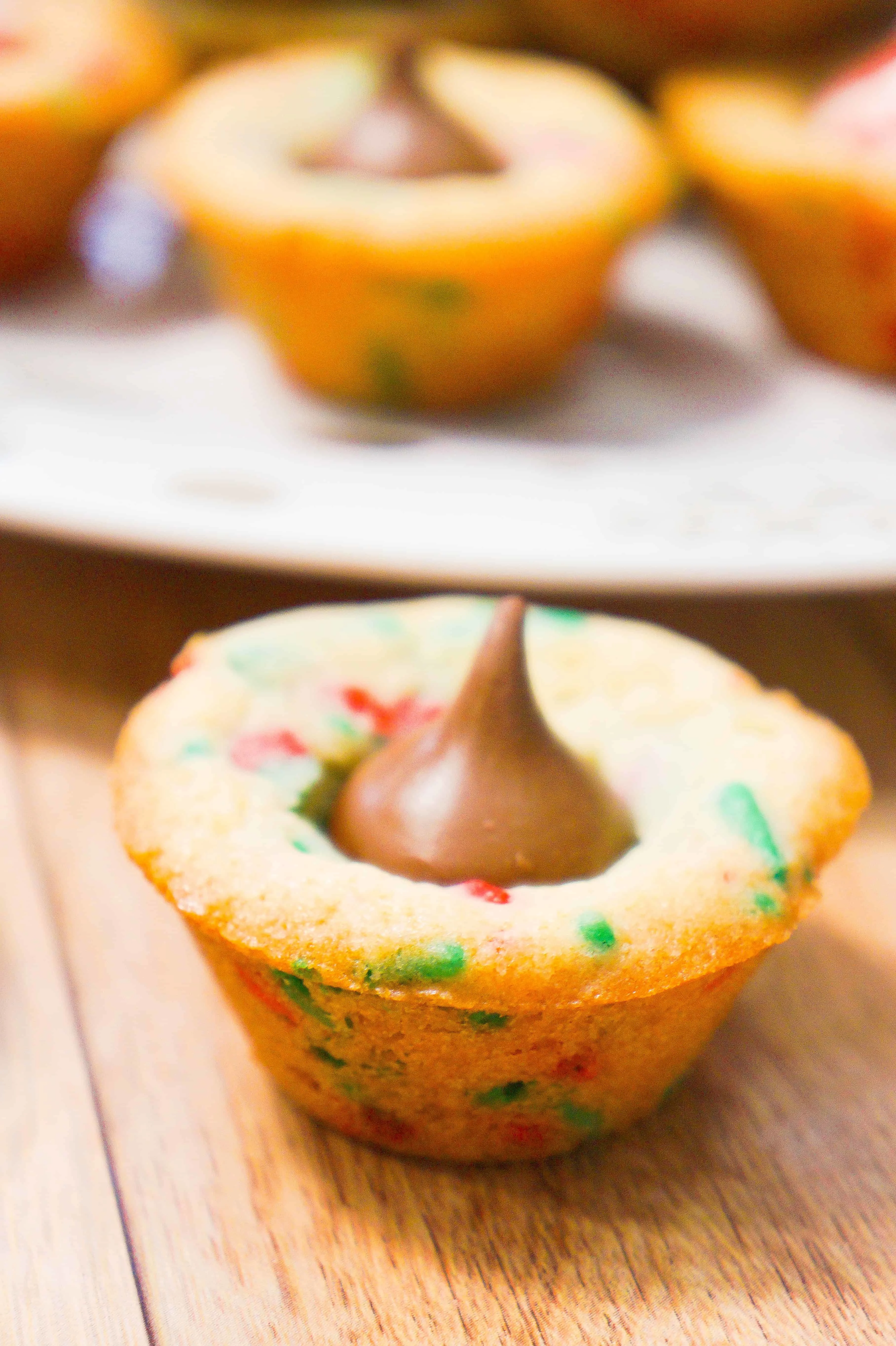 Soft and chewy sugar cookie cups filled with Hershey's Kisses.
