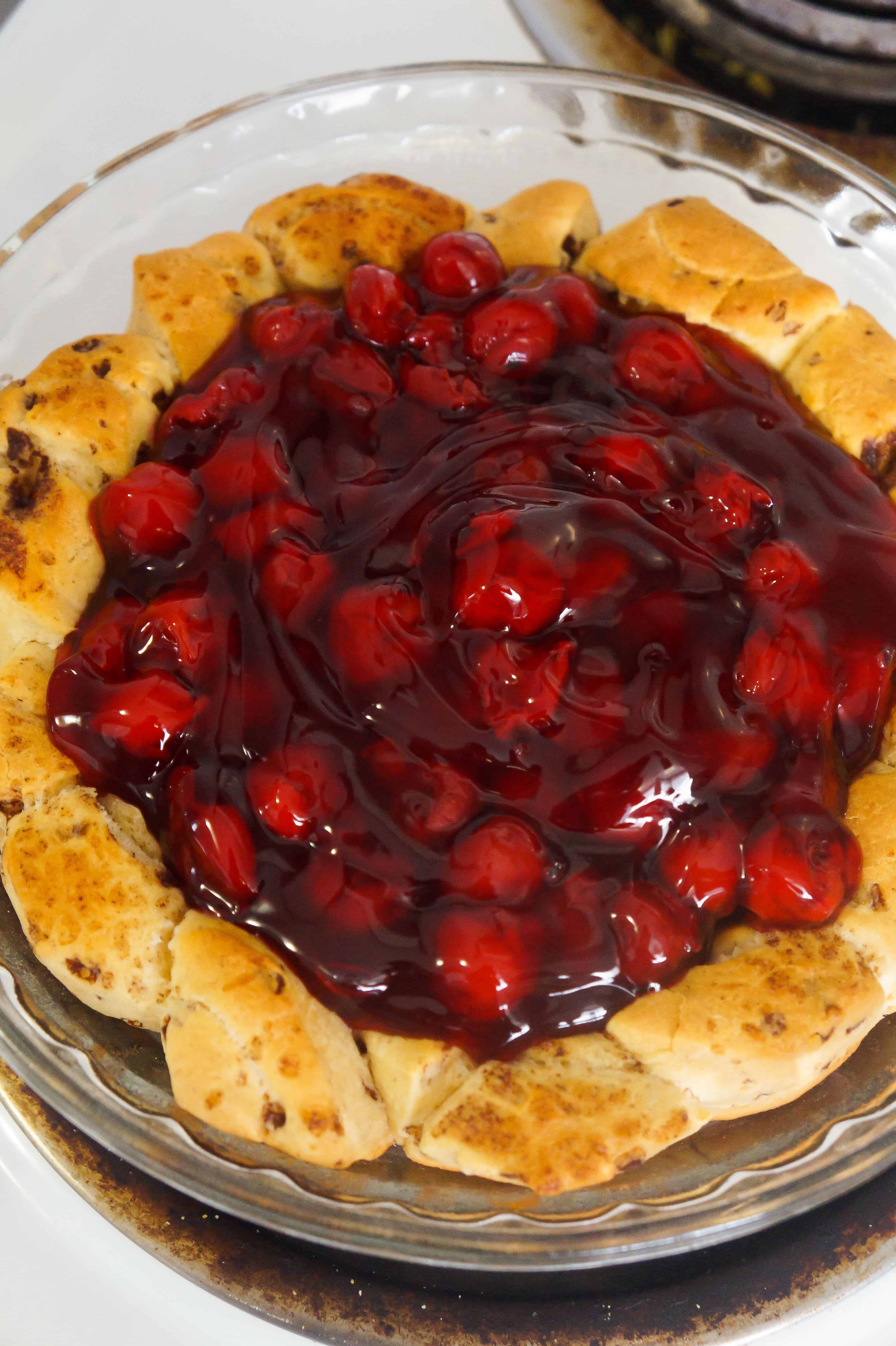 Cinnamon roll pie crust filled with cherry pie filling.