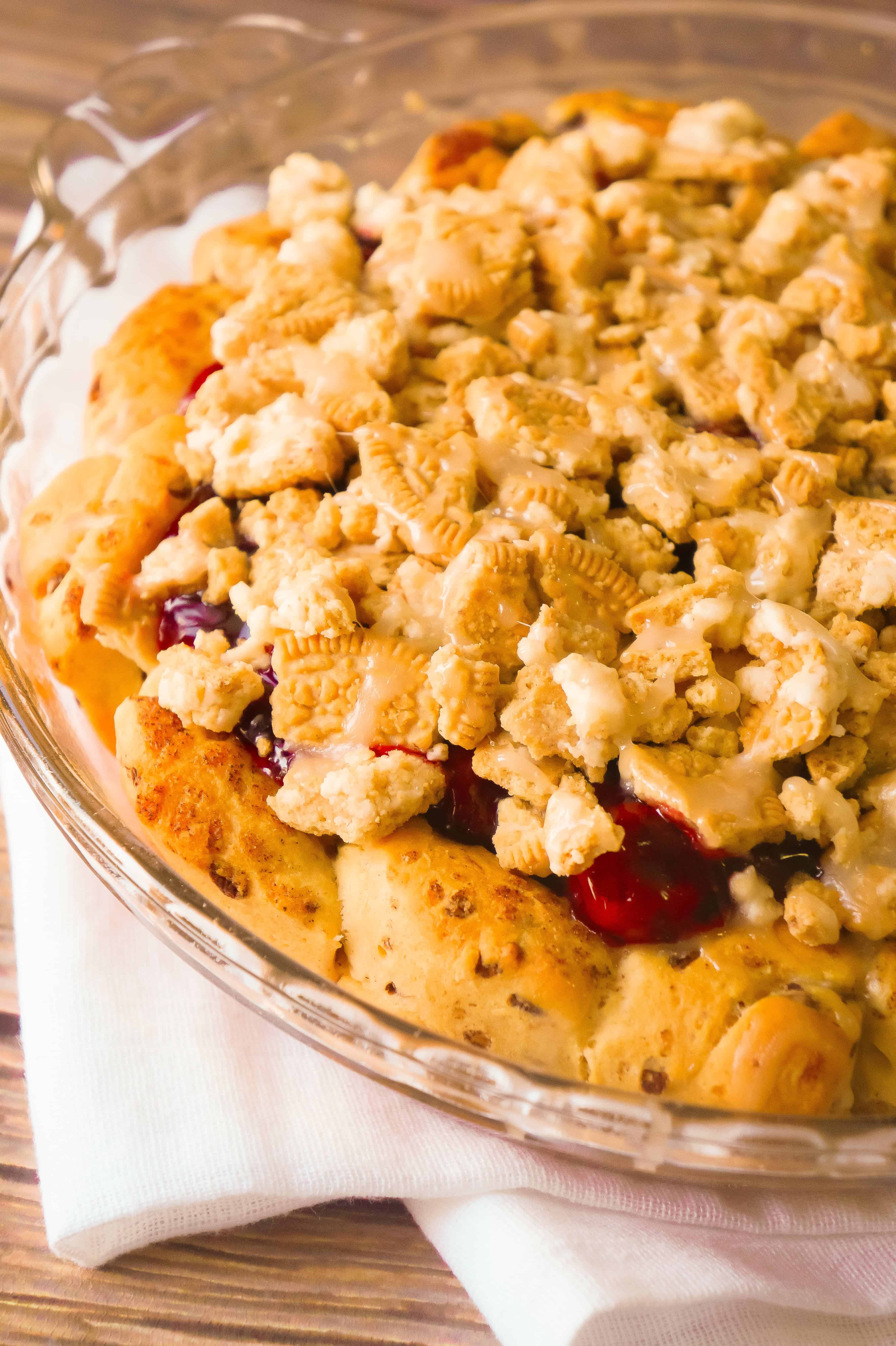 Cinnamon Bun Cherry Pie is an easy pie recipe using Pillsbury Cinnamon Rolls and canned cherry pie filling. This cherry pie is topped with crumbled Cinnamon Bun Oreos.