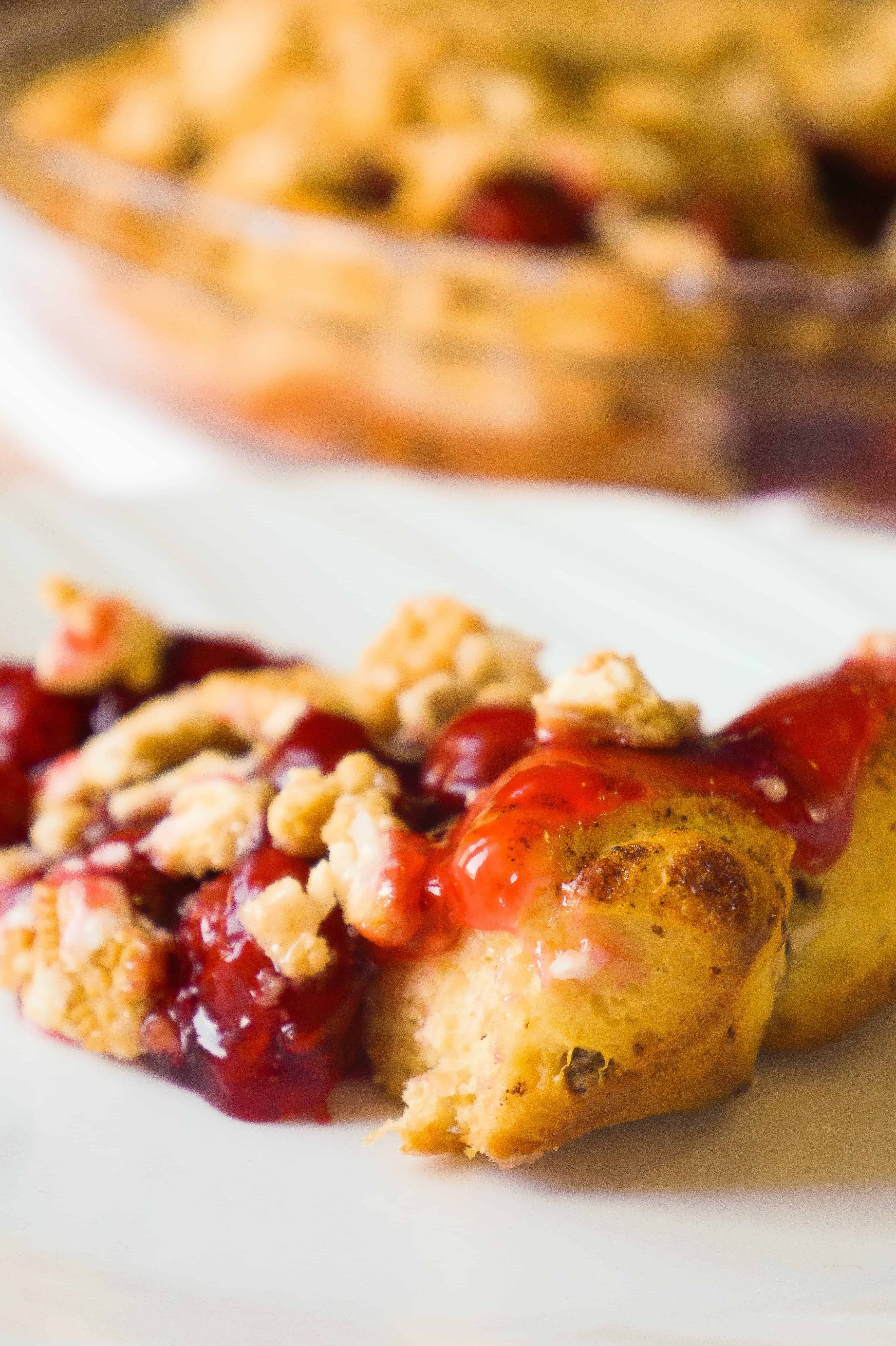 Cinnamon Bun Cherry Pie is an easy pie recipe using Pillsbury Cinnamon Rolls and canned cherry pie filling. This cherry pie is topped with crumbled Cinnamon Bun Oreos.