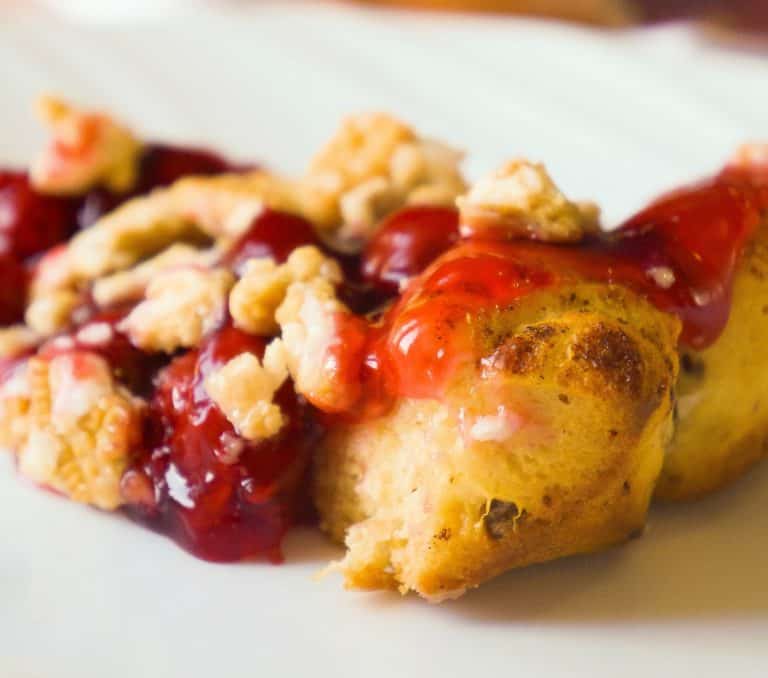 Cinnamon Bun Cherry Pie is an easy pie recipe using Pillsbury Cinnamon Rolls and canned cherry pie filling. This cherry pie is topped with crumbled Cinnamon Bun Oreos.