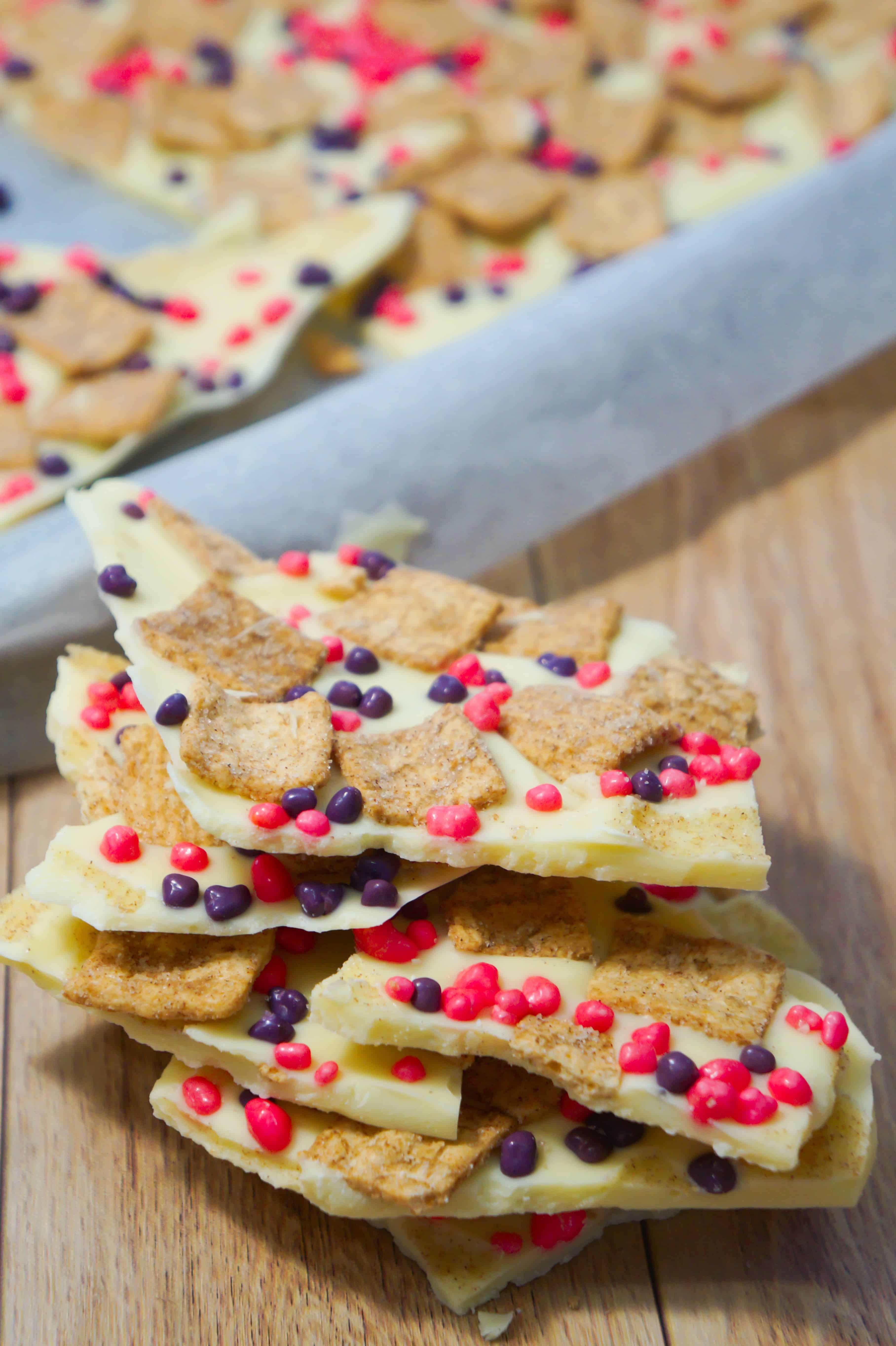 Cinnamon Toast Crunch White Chocolate Bark is an easy no bake dessert recipe. This white chocolate dessert is loaded with Cinnamon Toast Crunch Cereal and pink and purple Nerds candies.