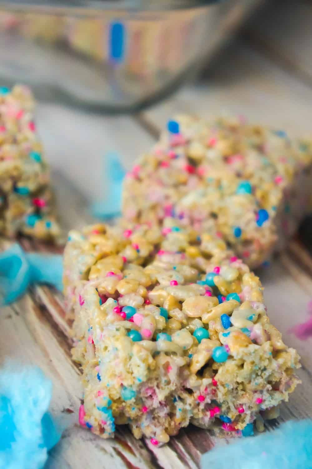 Cotton Candy Rice Krispie Treats are an easy dessert recipe your kids will love. These rice krispie squares are made with melted cotton candy and loaded with cotton candy coloured sprinkles.