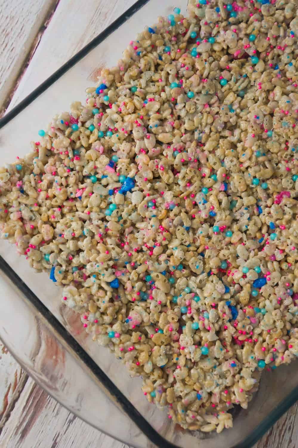 Cotton Candy Rice Krispie Treats are an easy dessert recipe your kids will love. These rice krispie squares are made with melted cotton candy and loaded with cotton candy coloured sprinkles.