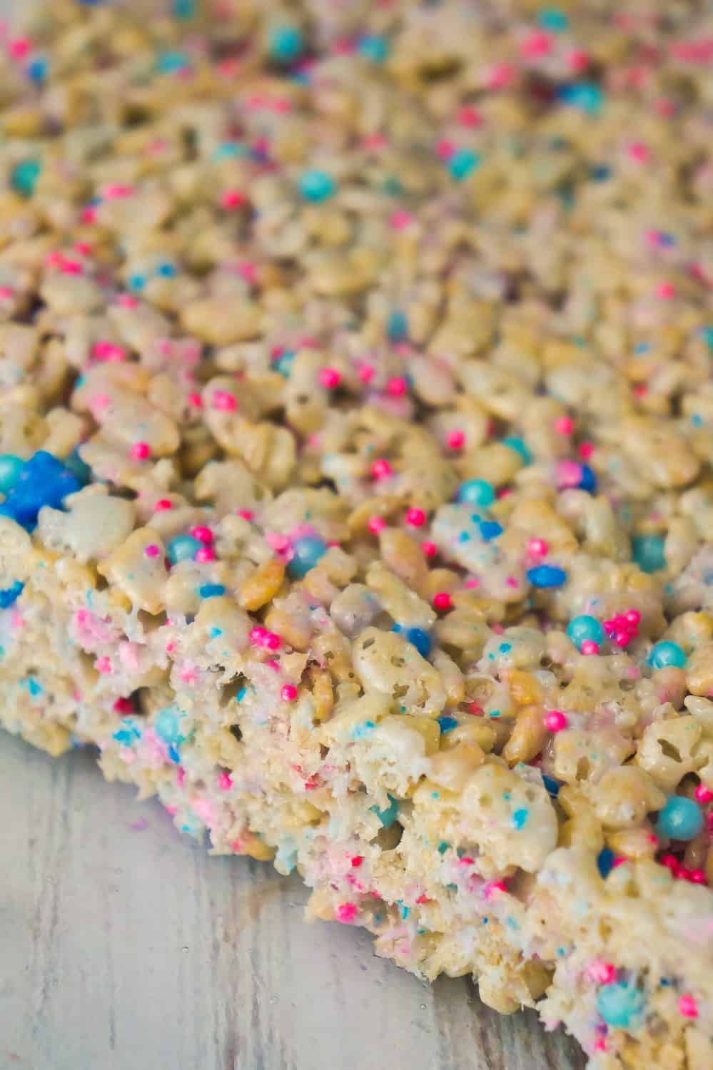 Cotton Candy Rice Krispie Treats are an easy dessert recipe your kids will love. These rice krispie squares are made with melted cotton candy and loaded with cotton candy coloured sprinkles.