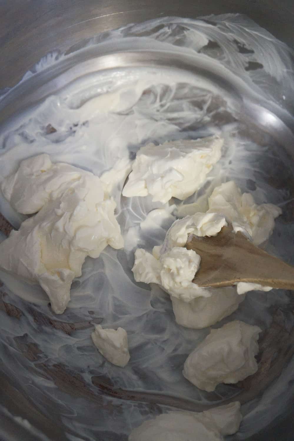 melting cream cheese in a sauce pan