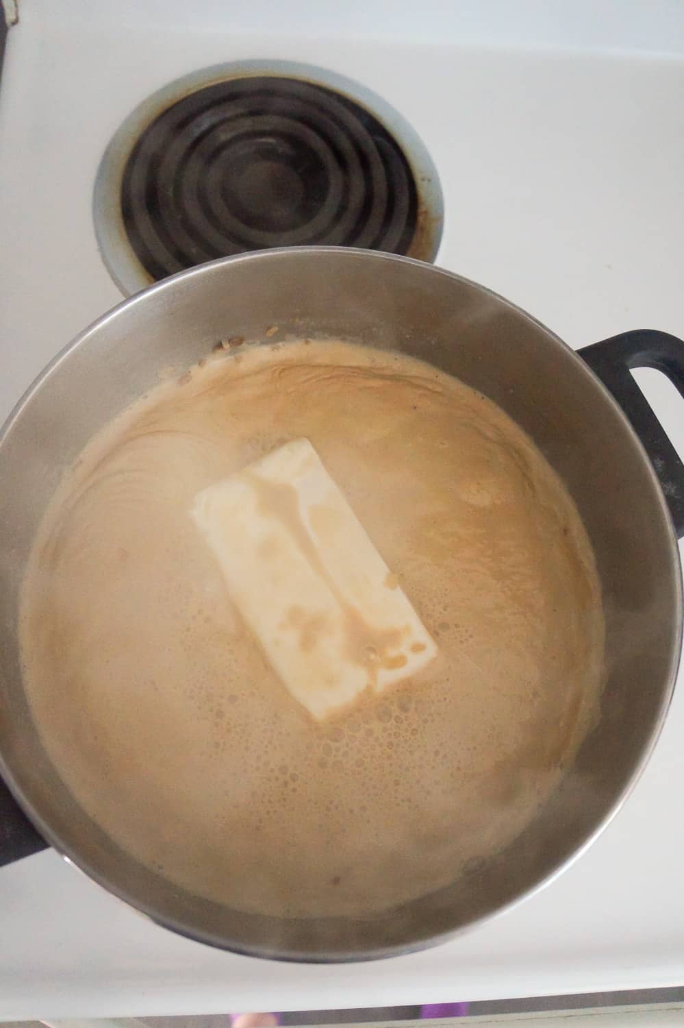 cream cheese brick added to onion soup in large saucepan
