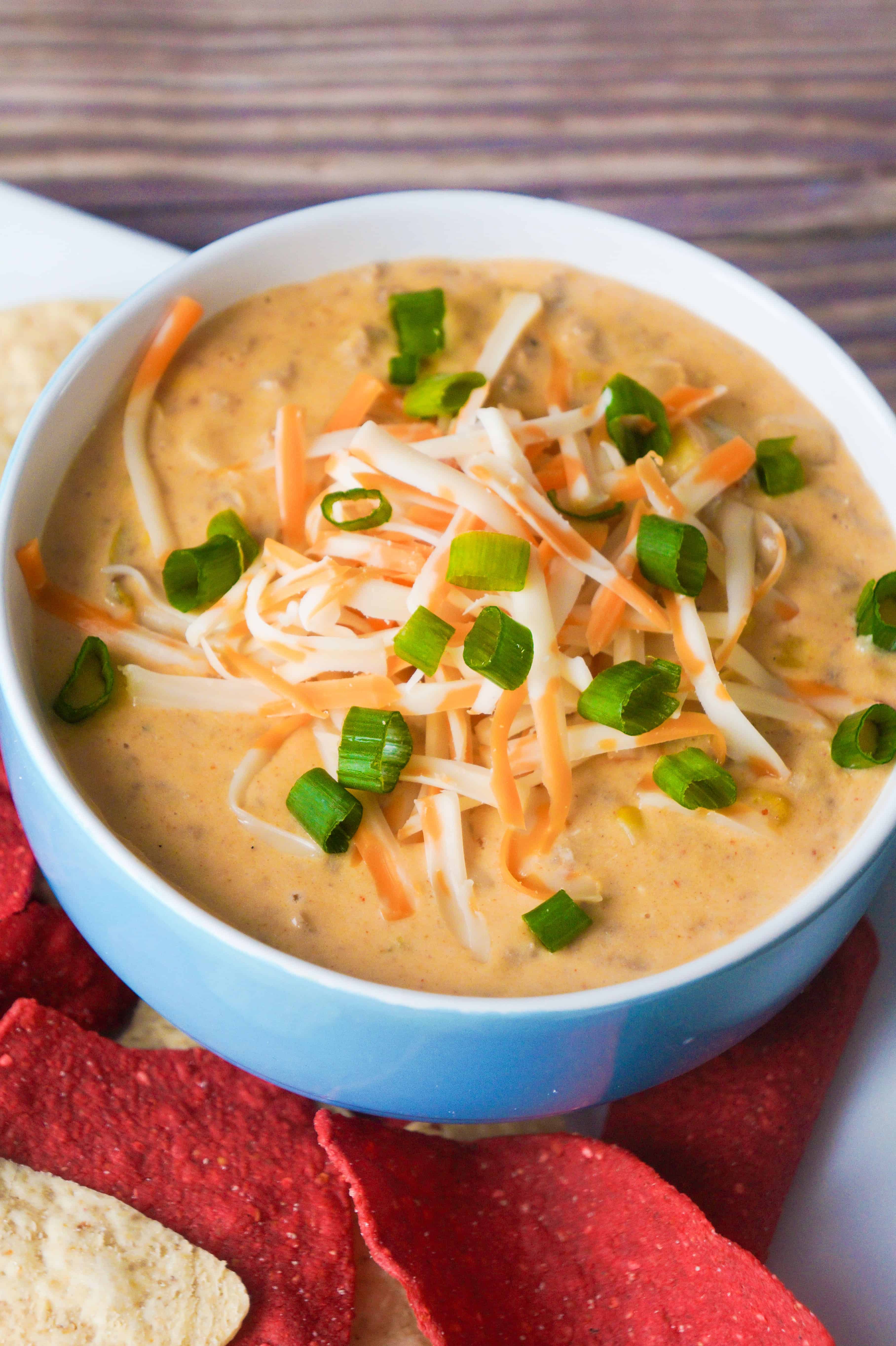 Bowl of creamy ground chicken chili with cream cheese and cheddar cheese.