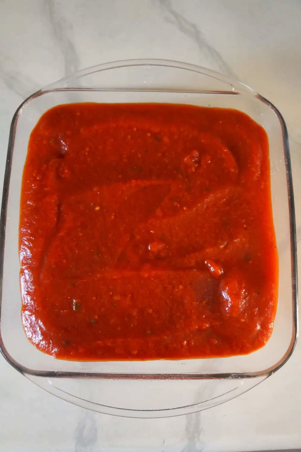 marinara sauce on top of ground chicken casserole