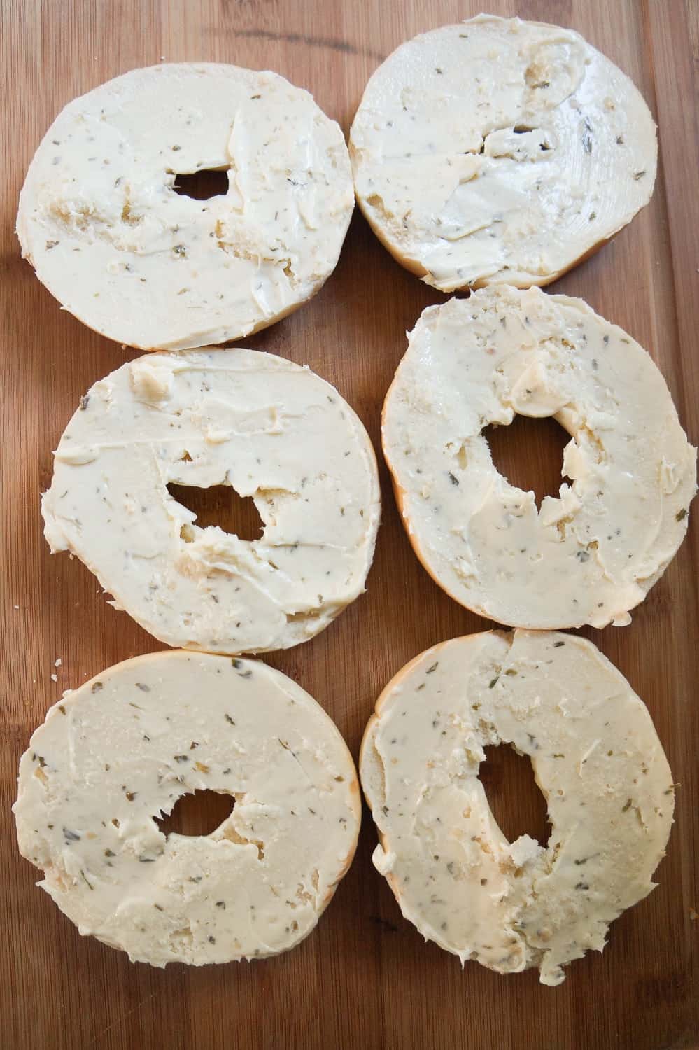 sliced bagels spread with garlic margarine