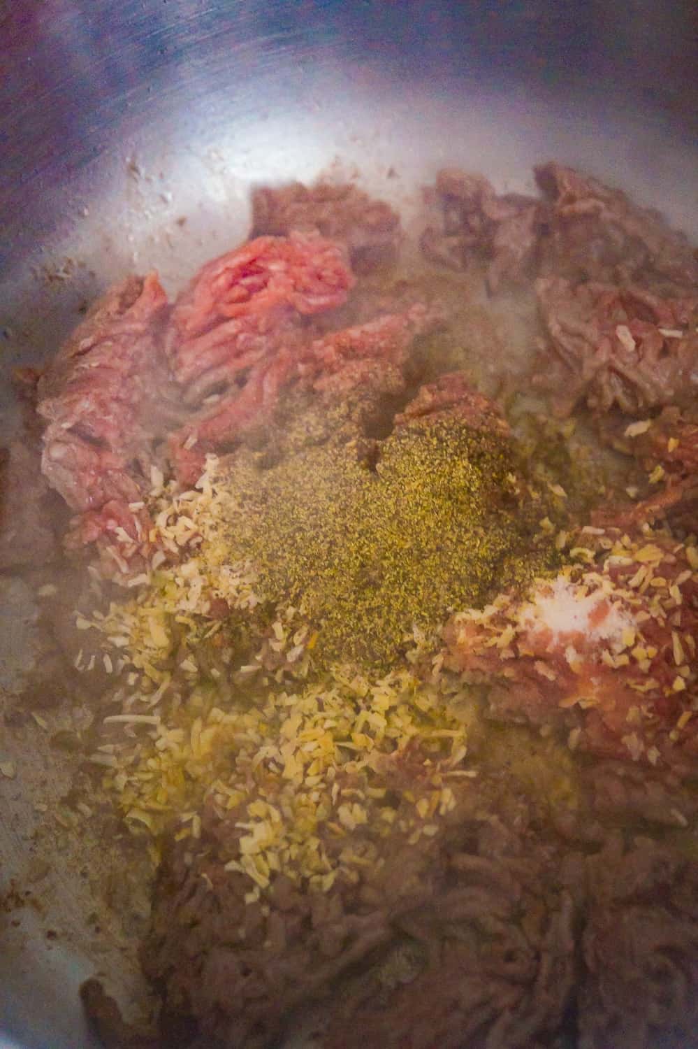 ground beef seasoned with pepper, salt and minced onion while cooking
