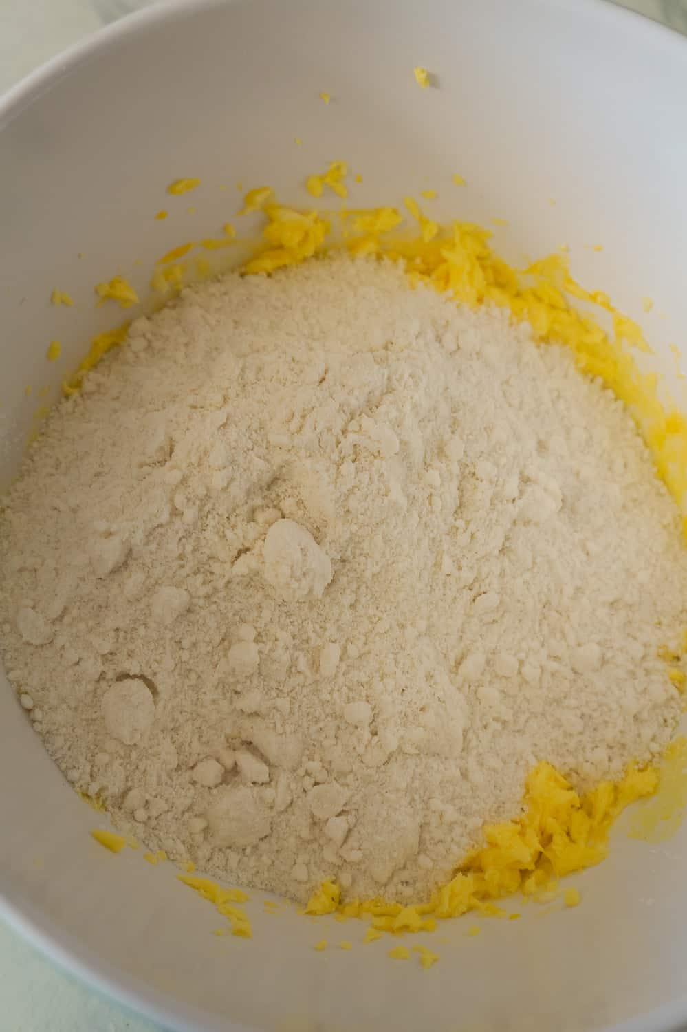 sugar cookie mix added to mixing bowl with lemon pudding mixture