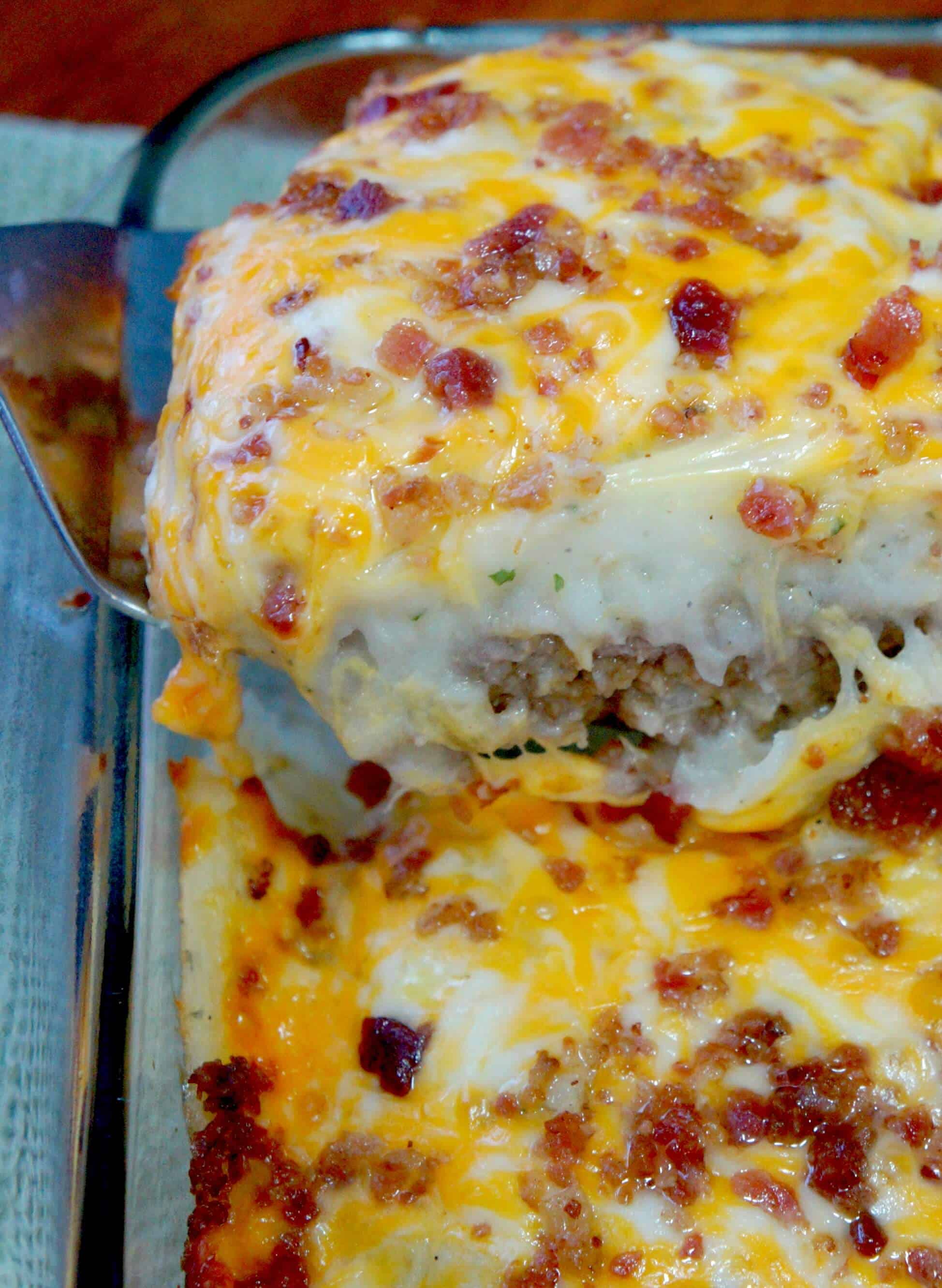 Loaded Potato Meatloaf Casserole. Ground beef meatloaf topped with garlicky instant mashed potatoes, cheese and bacon. Easy dinner recipe.