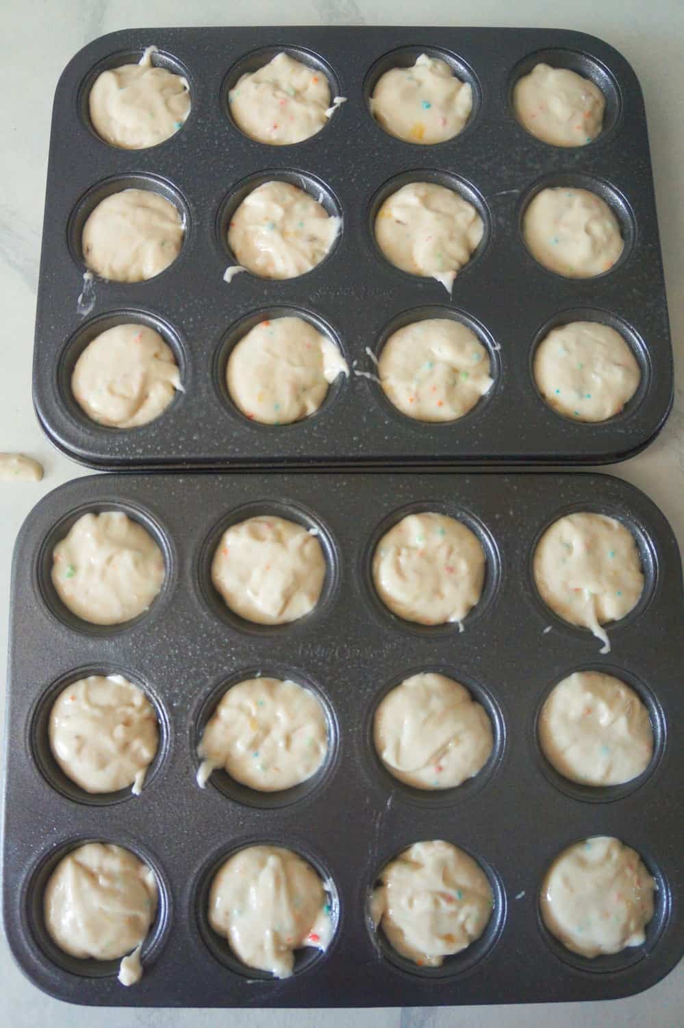 banana muffin batter in mini muffin tins