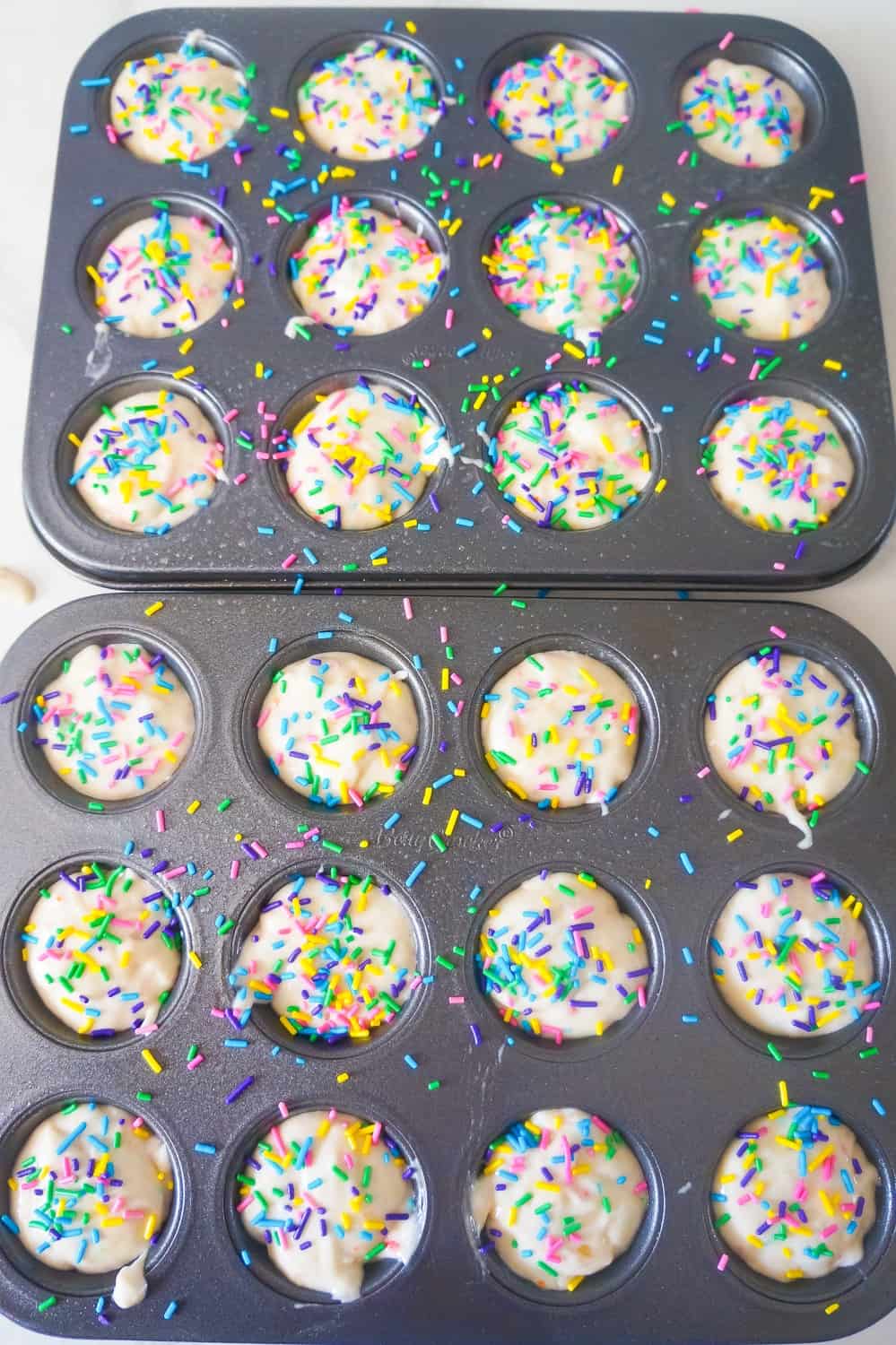 sprinkles on top of banana muffin batter