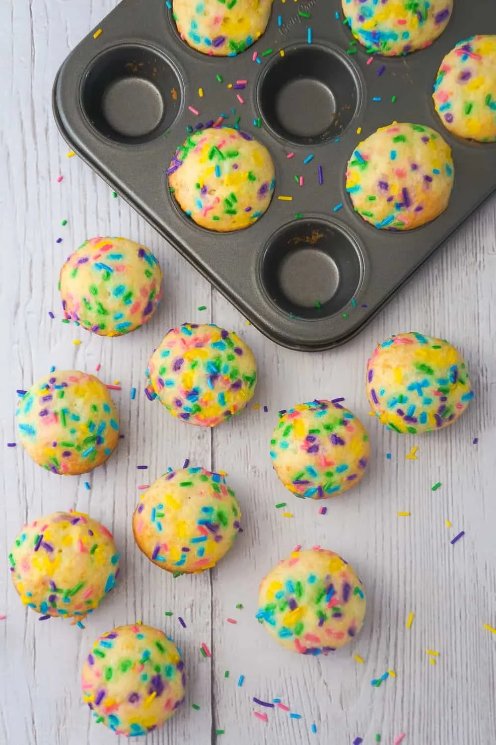 Mini Birthday Cake Banana Muffins are an easy snack or dessert your kids will love. These colourful mini muffins are made with confetti cake mix, ripe bananas and lots of sprinkles.