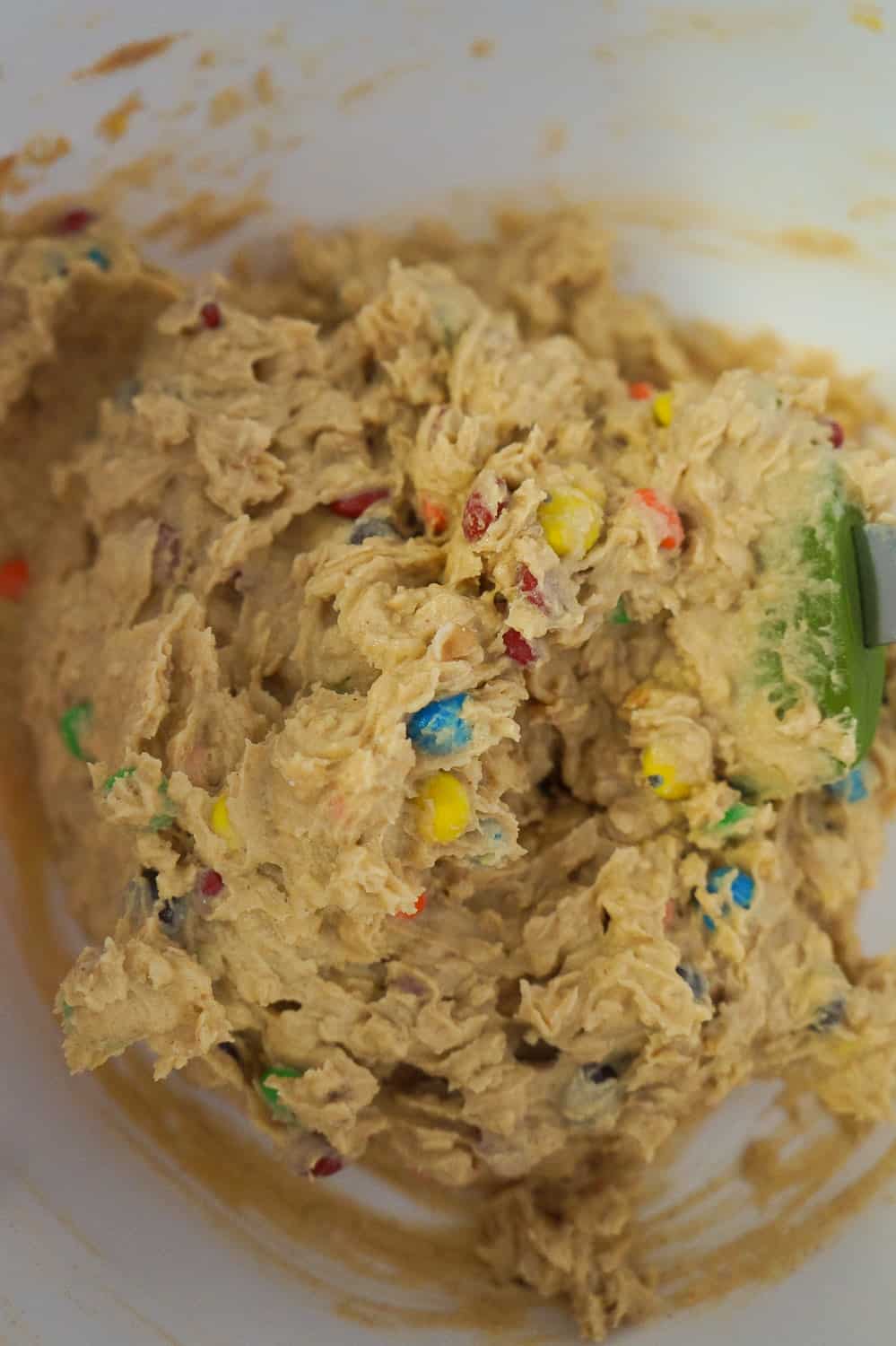 peanut butter oatmeal cookie dough with mini M&Ms in it
