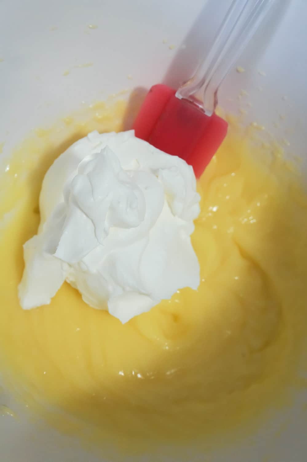 cool whip and vanilla pudding in mixing bowl