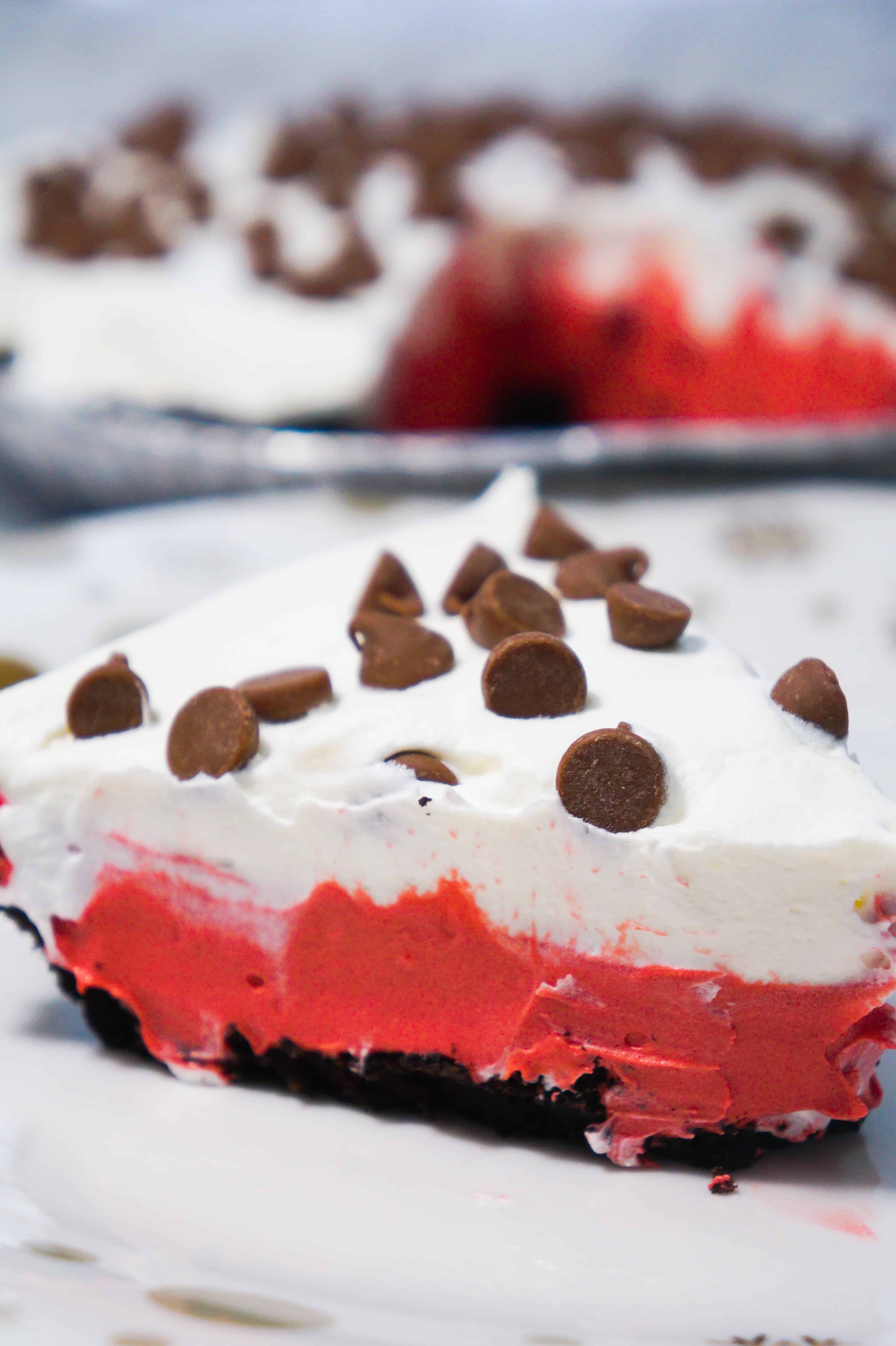 Slice of red velvet pudding pie with Oreo crust. Perfect summer dessert recipe.