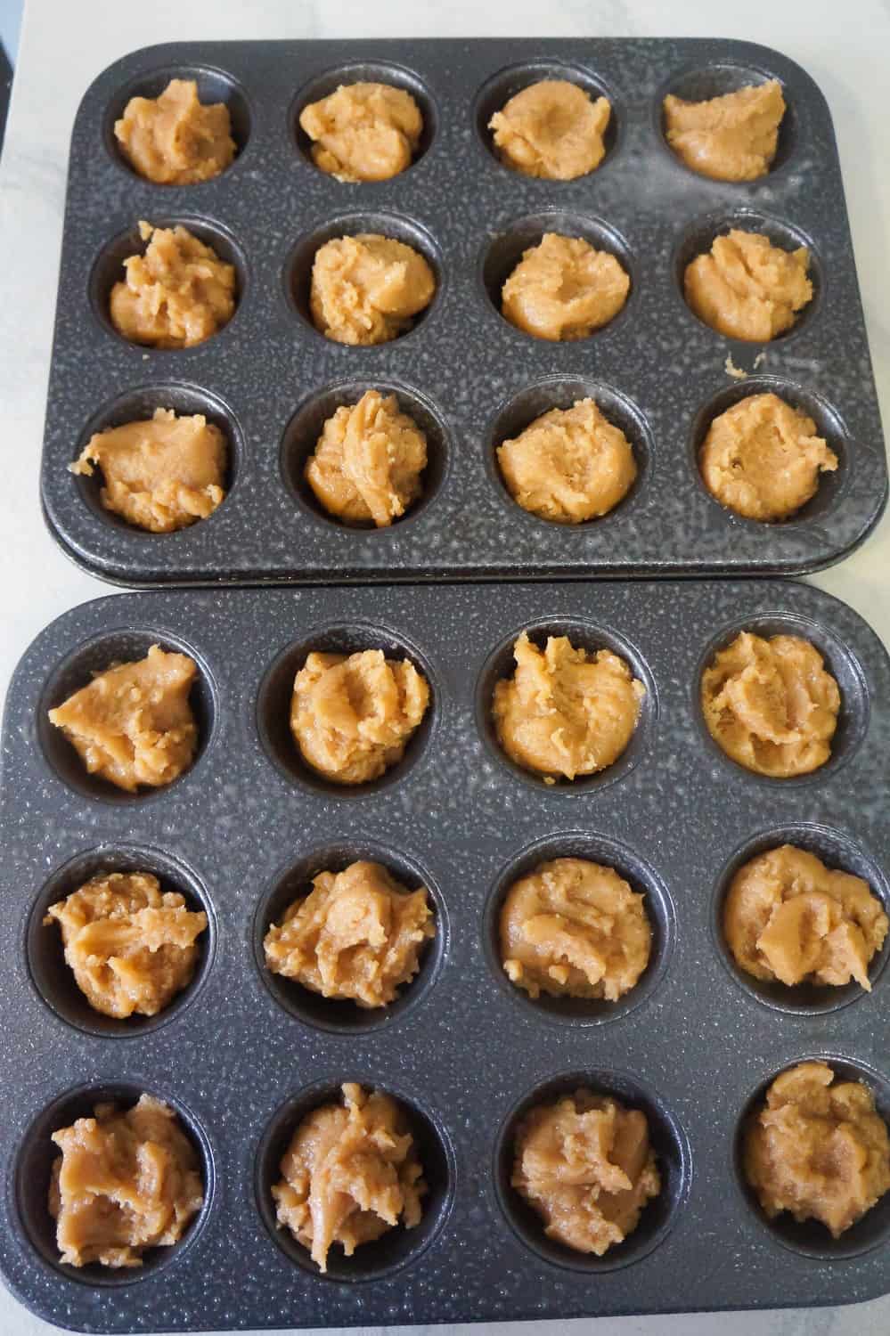 blondie batter in muffin tins