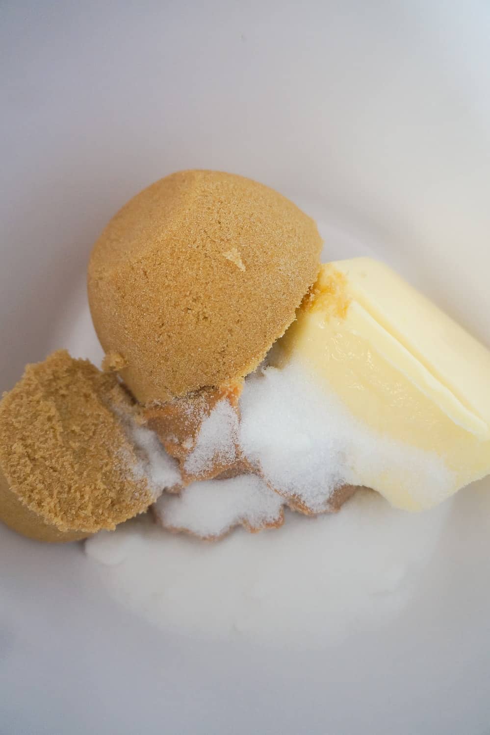 peanut butter, butter, brown sugar and white sugar in mixing bowl