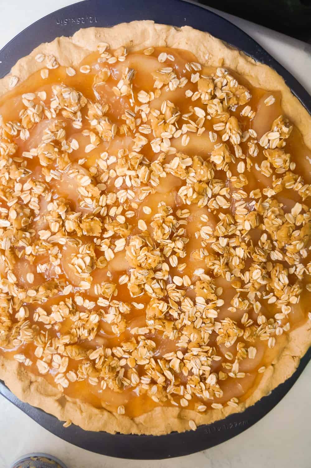 peanut butter apple pie cookie pizza before baking
