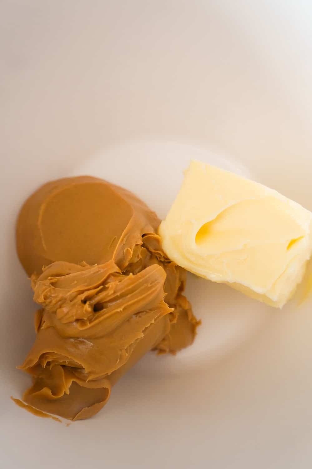 peanut butter and butter in a mixing bowl