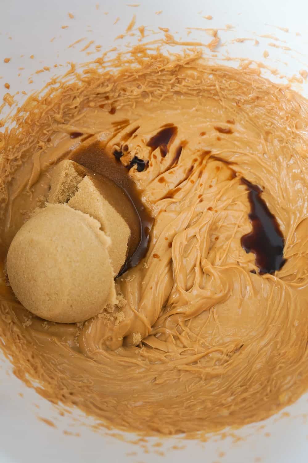 brown sugar and vanilla added to peanut butter and butter mixture in mixing bowl