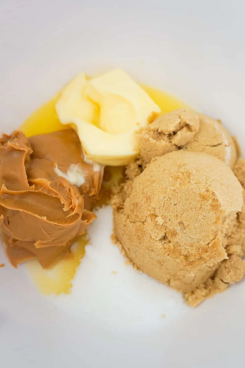 peanut butter, butter, brown sugar and granulated sugar in a large mixing bowl