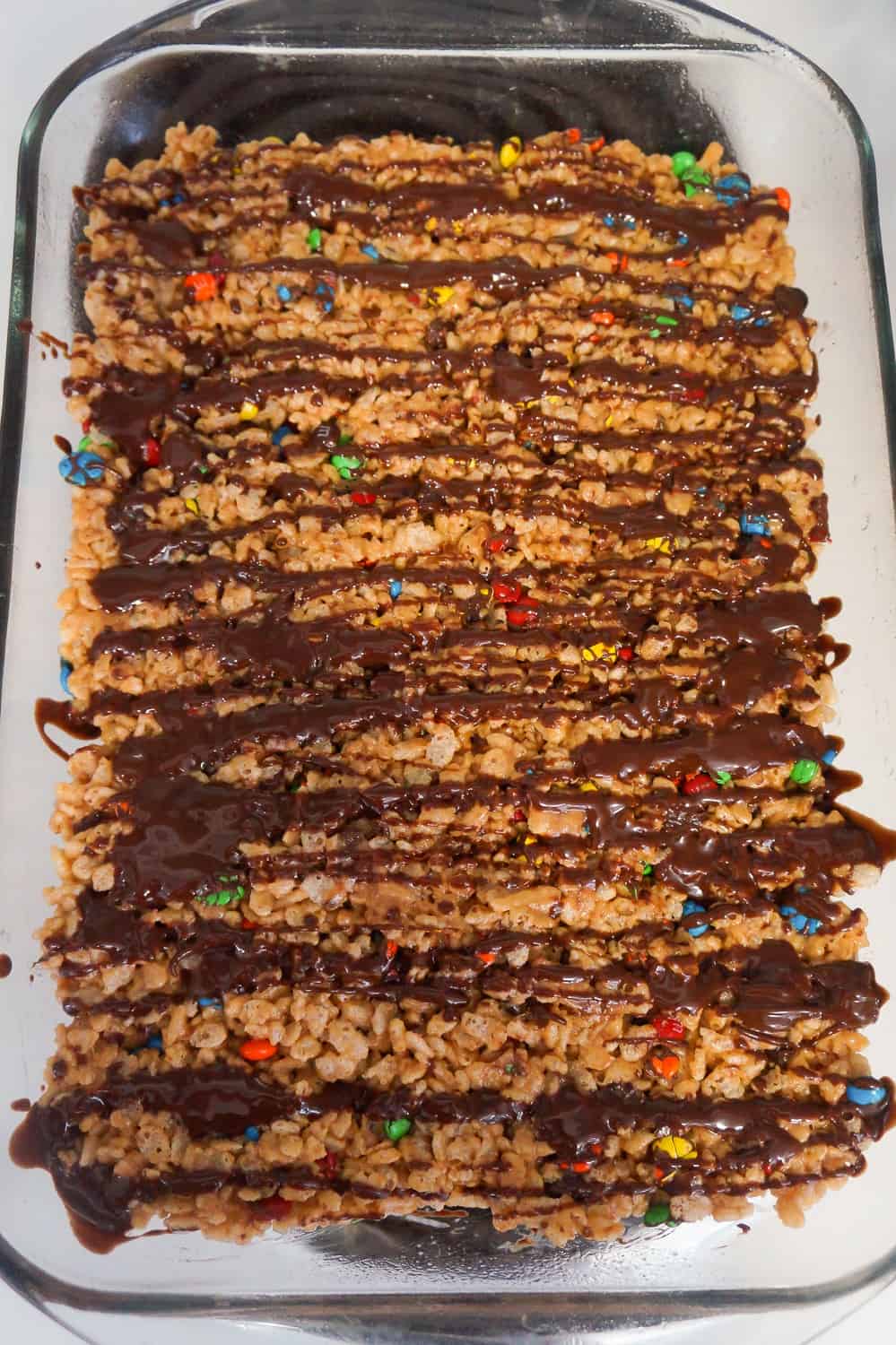 melted chocolate drizzled over peanut butter rice krispie treats