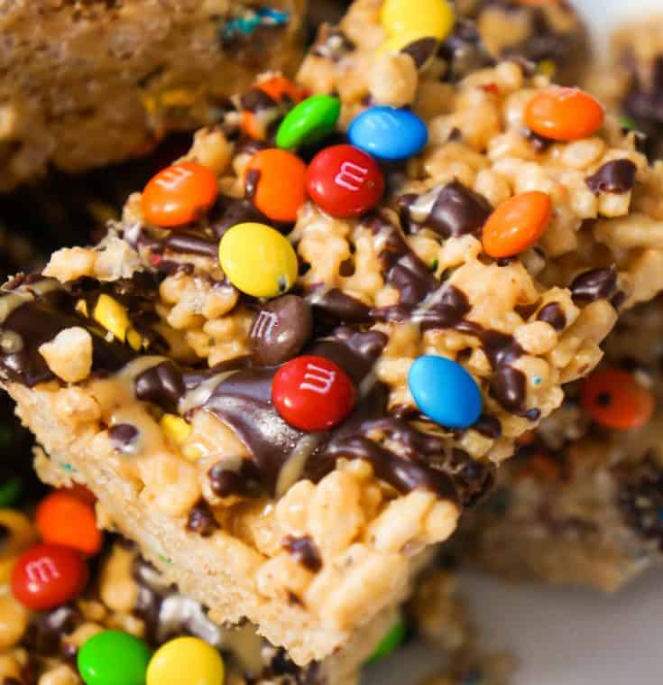 Peanut Butter Rice Krispie Treats. Easy chocolate peanut butter dessert recipe. Rice Krispie squares loaded with M&Ms.