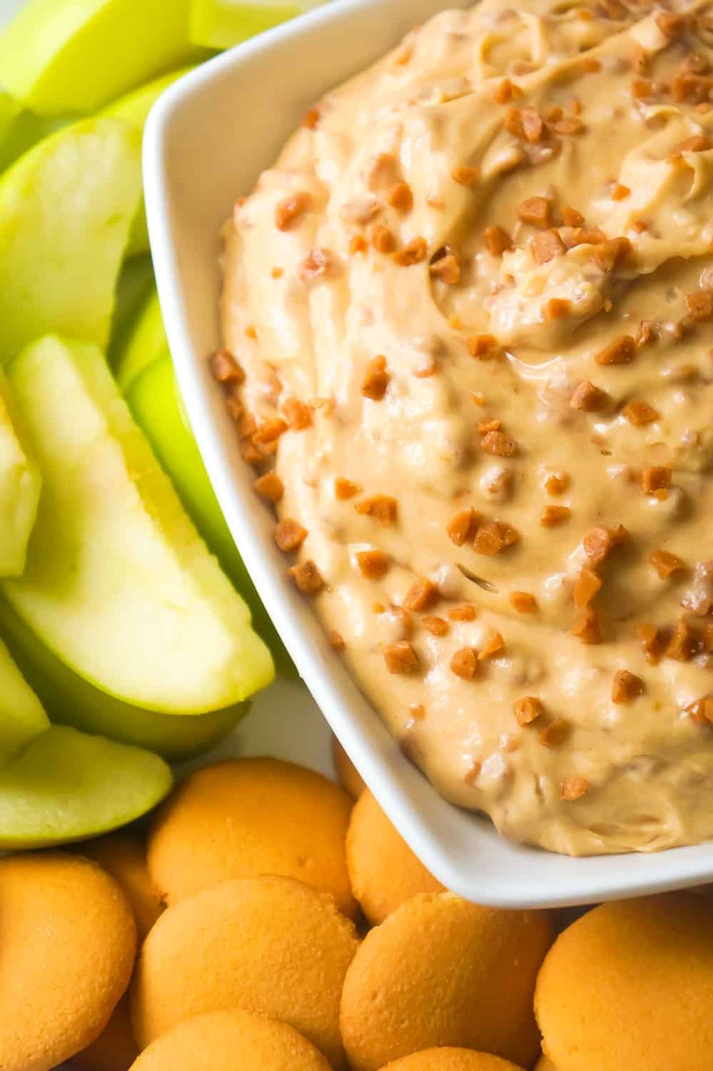 Peanut Butter Toffee Cheesecake Dip is an easy no bake dessert recipe perfect for summer. This sweet cream cheese dip loaded with Skor bits, is perfect to serve with fruit or cookies.