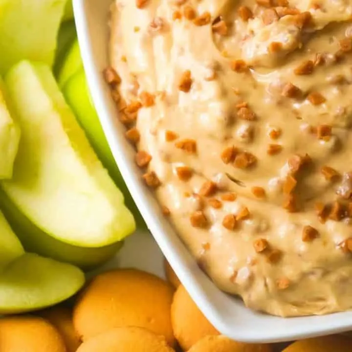 Peanut Butter Toffee Cheesecake Dip is an easy no bake dessert recipe perfect for summer. This sweet cream cheese dip loaded with Skor bits, is perfect to serve with fruit or cookies.