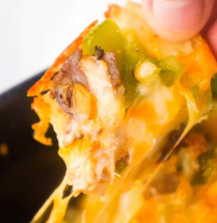 Philly Cheese Steak Pull Apart Bread is an easy party food perfect for game day. Bite sized pieces of bagel are loaded with roast beef, green peppers and cheddar cheese.
