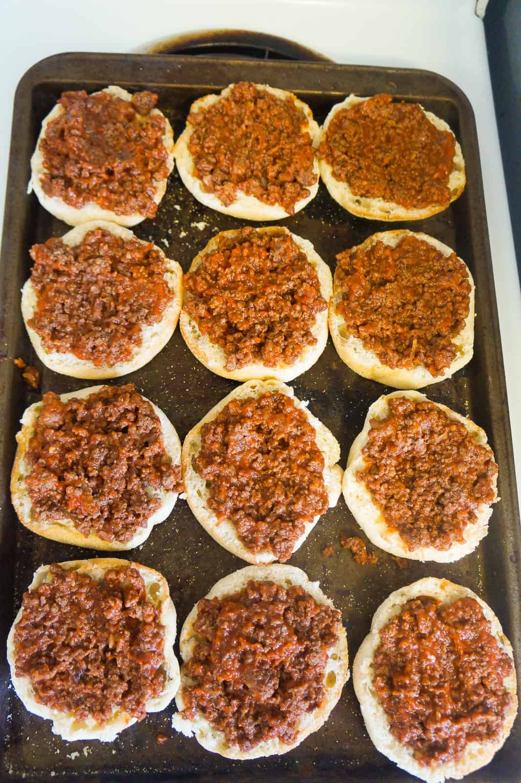 ground beef and pizza sauce on english muffins