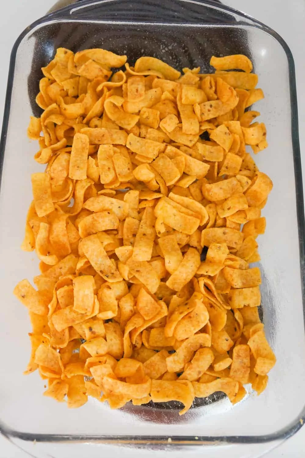 corn chips in the bottom of a baking dish