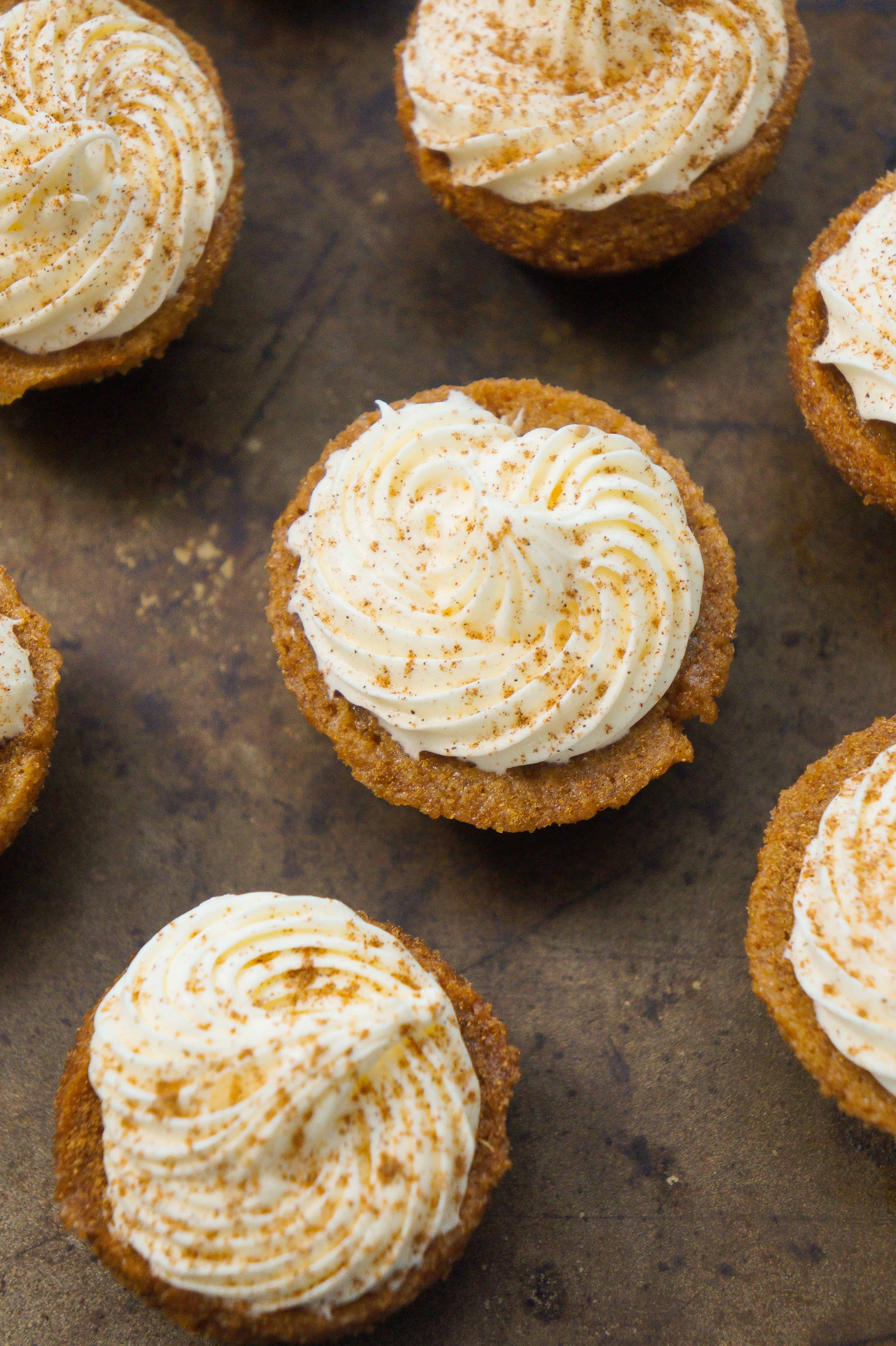 Bite size pumpkin spice blondies with cream cheese frosting. Perfect dessert for Thanksgiving and Halloween.