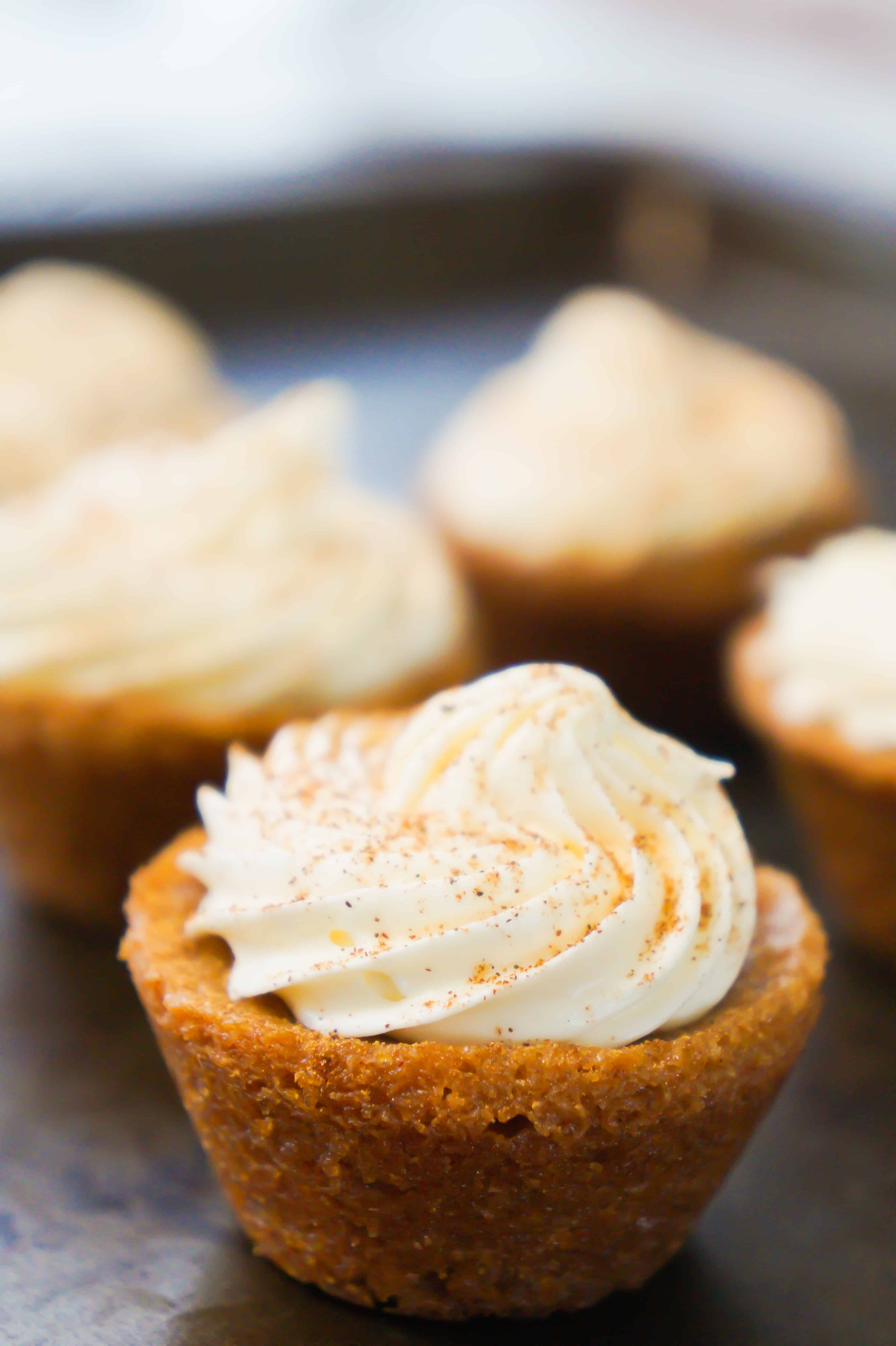 Bite size pumpkin spice blondies with cream cheese frosting. Perfect dessert for Thanksgiving and Halloween.