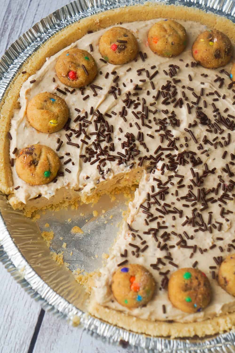 Rainbow Chip Cookie No Bake Cheesecake is an easy no bake pie recipe perfect for spring and summer. This tasty dessert is made in a shortbread pie crust and loaded with crushed Rainbow Chips Ahoy Cookies.