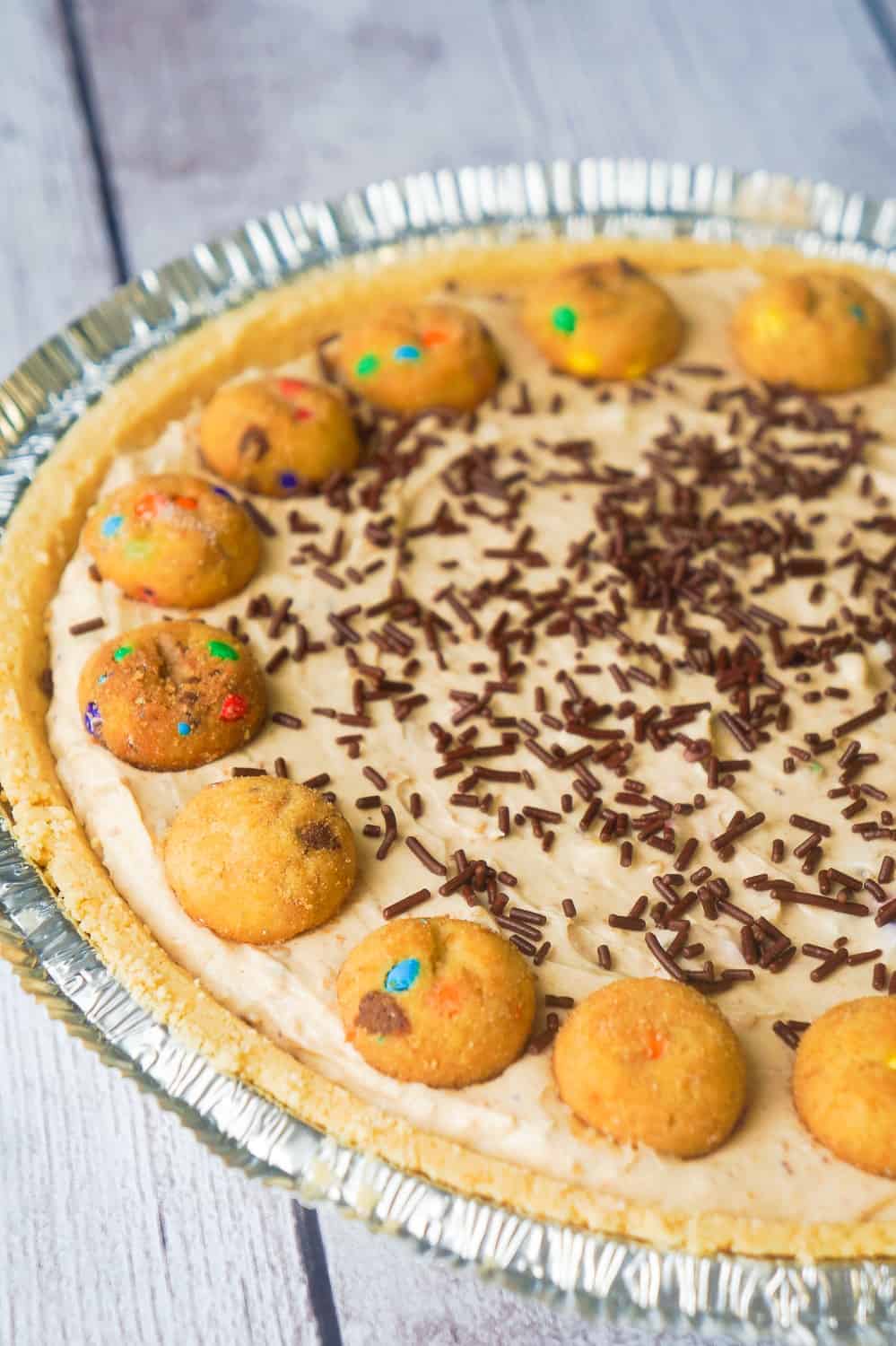 Rainbow Chip Cookie No Bake Cheesecake is an easy no bake pie recipe perfect for spring and summer. This tasty dessert is made in a shortbread pie crust and loaded with crushed Rainbow Chips Ahoy Cookies.