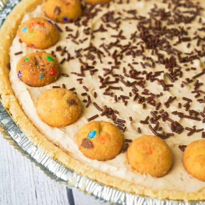 Rainbow Chip Cookie No Bake Cheesecake is an easy no bake pie recipe perfect for spring and summer. This tasty dessert is made in a shortbread pie crust and loaded with crushed Rainbow Chips Ahoy Cookies.