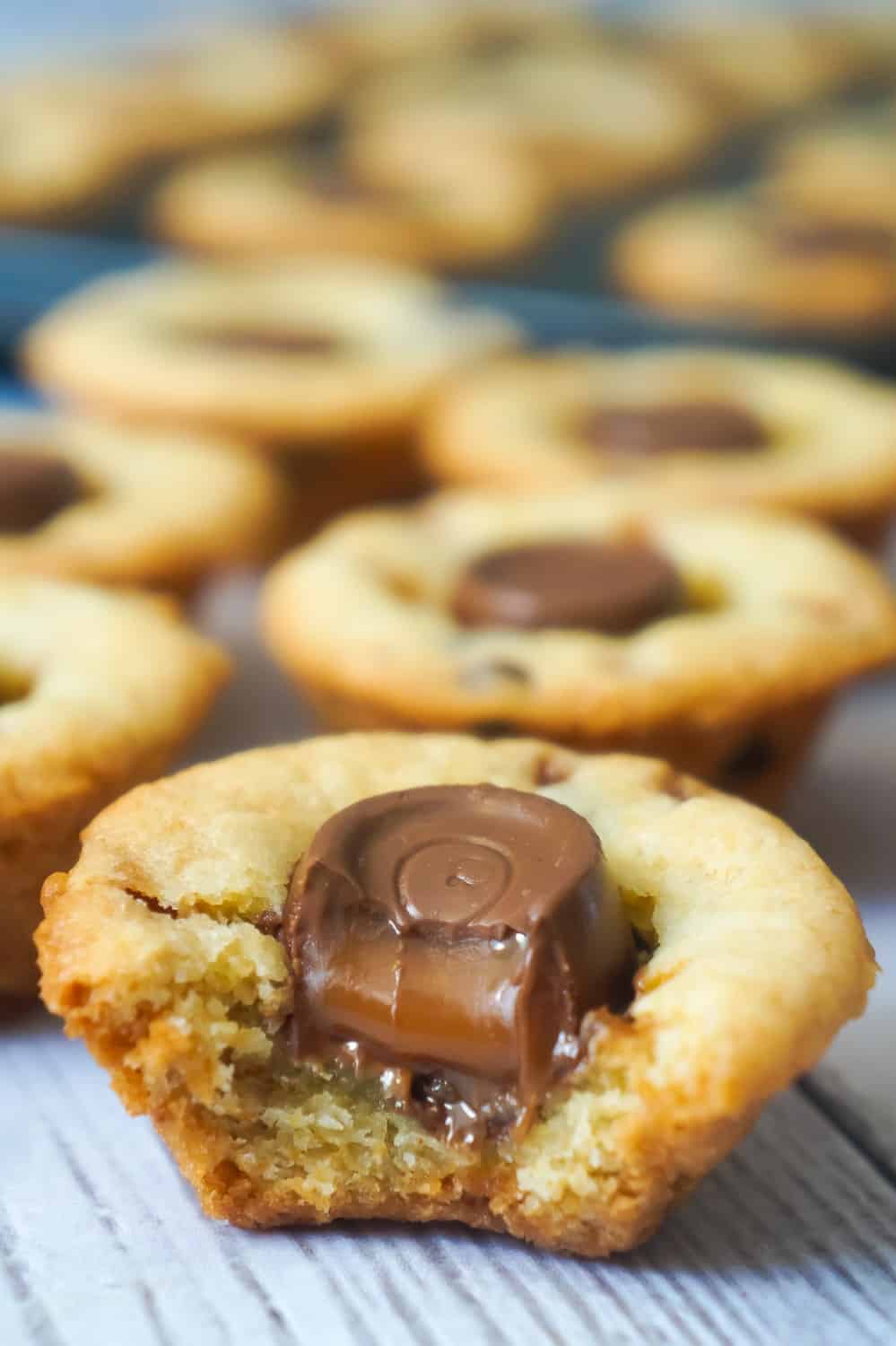 Rolo Sugar Cookie Cups are an easy dessert recipe using Betty Crocker Sugar Cookie Mix. These delicious cookies are baked in mini muffin tins and loaded with Skor bits, mini chocolate chips and Rolo chocolates.